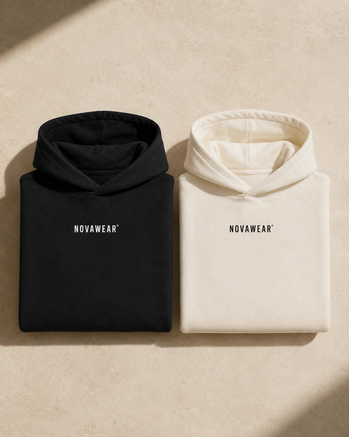 NOVAWEAR Oversized Hoodie – Flatlay in Schwarz und Natural Raw